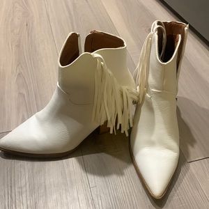 White faux leather booties with fringe. Worn once.